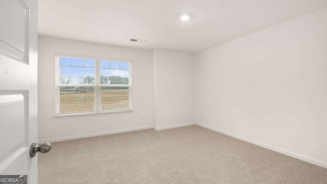 1099 Blue Juniper Cir, Loganville, GA 30052 - empty room featuring baseboards, carpet flooring, and visible vents