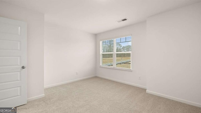 1099 Blue Juniper Cir, Loganville, GA 30052 - carpeted empty room featuring baseboards and visible vents