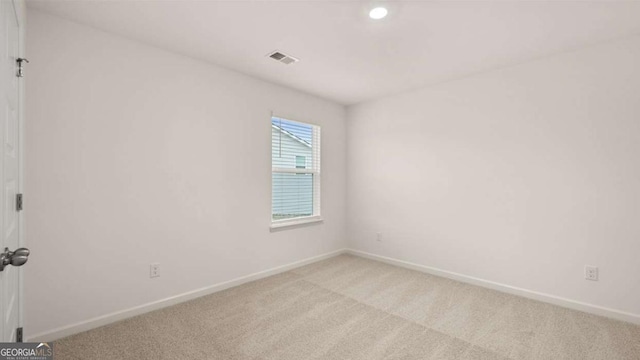 1099 Blue Juniper Cir, Loganville, GA 30052 - empty room with light carpet, baseboards, and visible vents
