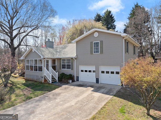 1595 Historic Old Highway 441, Clarkesville, GA 30523 - view of front of house with a chimney, concrete driveway, a garage, a sunroom, and a front lawn