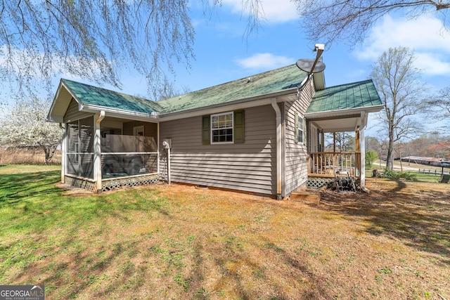 1595 Historic Old Highway 441, Clarkesville, GA 30523 - view of side of property with a yard, a sunroom, a metal roof, and a porch