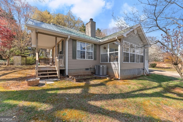 1595 Historic Old Highway 441, Clarkesville, GA 30523 - back of house featuring a chimney, a sunroom, a lawn, a metal roof, and crawl space