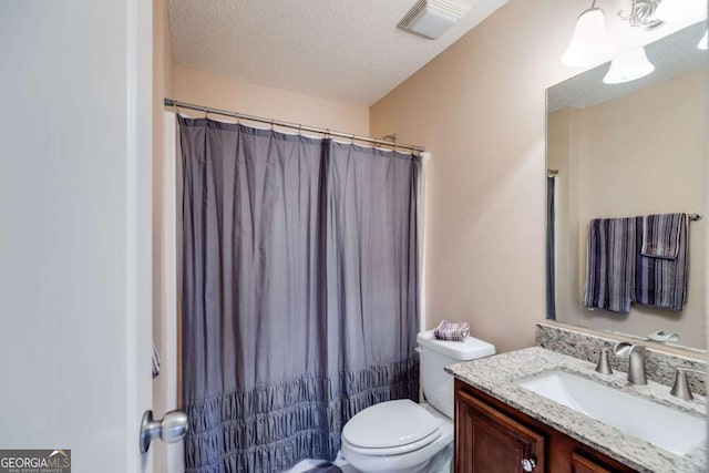 8166 N Pine Cone Dr, Villa Rica, GA 30180 - bathroom with a textured ceiling, visible vents, toilet, curtained shower, and vanity