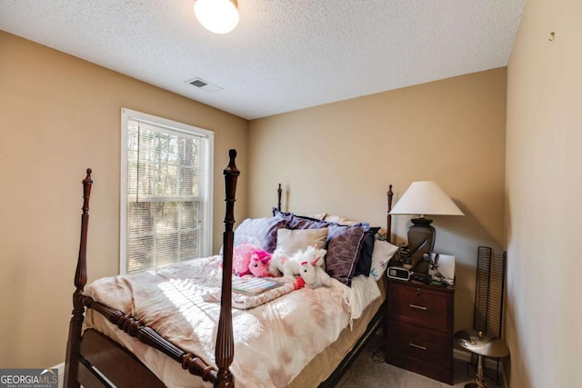 8166 N Pine Cone Dr, Villa Rica, GA 30180 - bedroom featuring a textured ceiling, visible vents, and carpet