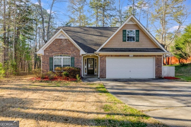 8166 N Pine Cone Dr, Villa Rica, GA 30180 - view of front facade with driveway, brick siding, a front lawn, a shingled roof, and a garage