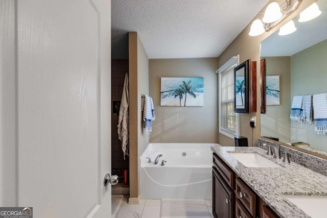8166 N Pine Cone Dr, Villa Rica, GA 30180 - full bathroom with double vanity, a sink, a garden tub, and a textured ceiling
