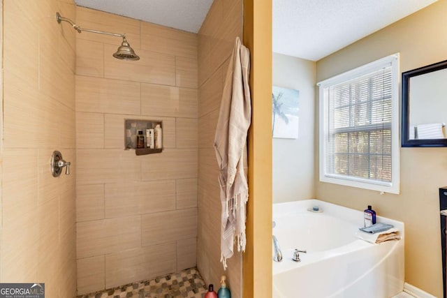 8166 N Pine Cone Dr, Villa Rica, GA 30180 - full bathroom featuring a tile shower, a bath, and a textured ceiling
