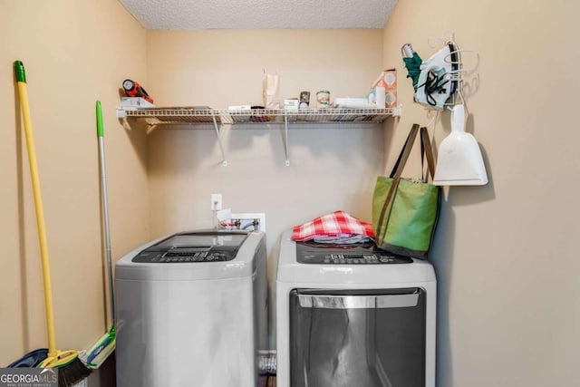8166 N Pine Cone Dr, Villa Rica, GA 30180 - laundry room with washer and dryer, laundry area, and a textured ceiling