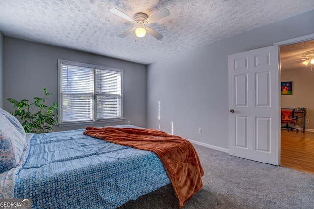 106 Kirkland Rd, Covington, GA 30016 - carpeted bedroom with a textured ceiling and ceiling fan