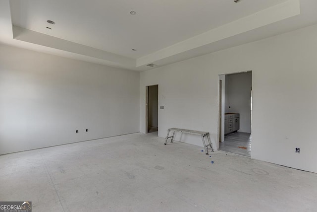 3748 Cheyenne Ln, Jefferson, GA 30549 - unfurnished bedroom featuring concrete flooring and a raised ceiling