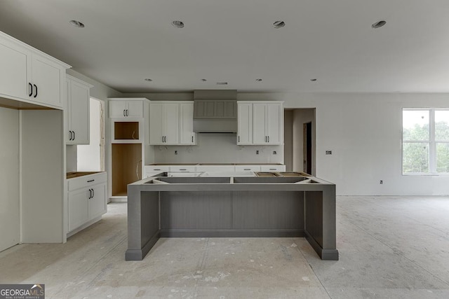3748 Cheyenne Ln, Jefferson, GA 30549 - kitchen with a kitchen island, white cabinets, and custom exhaust hood