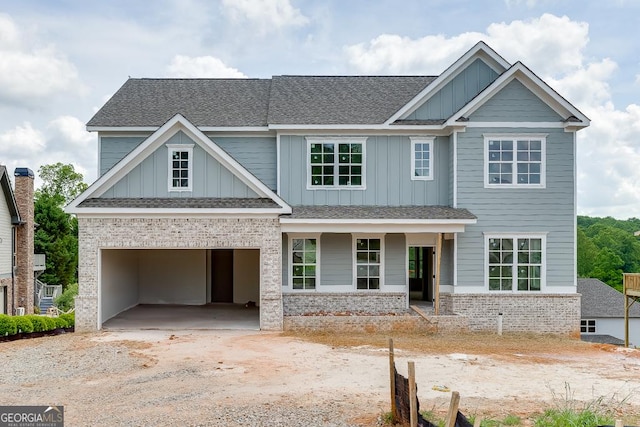 3787 Cheyenne Ln, Jefferson, GA 30549 - craftsman house featuring board and batten siding, driveway, and a shingled roof