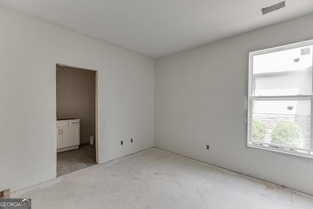 3787 Cheyenne Ln, Jefferson, GA 30549 - unfurnished bedroom featuring multiple windows and ensuite bath