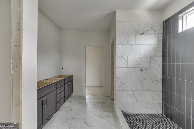 3787 Cheyenne Ln, Jefferson, GA 30549 - bathroom with marble look tiles, a tile shower, and vanity
