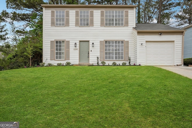 colonial house featuring driveway, an attached garage, a front lawn, and roof with shingles