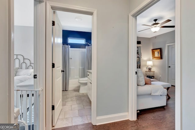 hall featuring baseboards