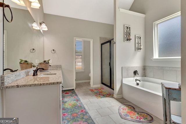 full bath with a bath, a shower stall, vanity, baseboards, and toilet