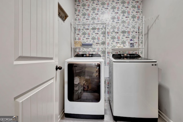 washroom with separate washer and dryer and laundry area