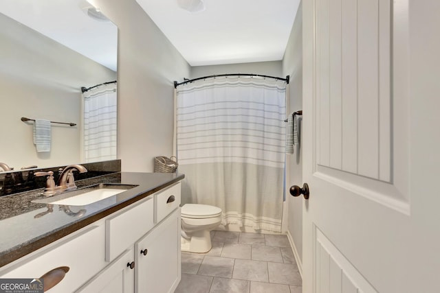 bathroom featuring vanity, tile patterned flooring, toilet, and a shower with shower curtain