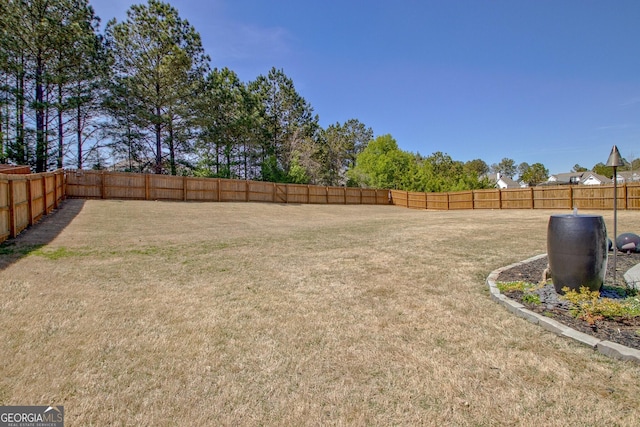 view of yard featuring a fenced backyard