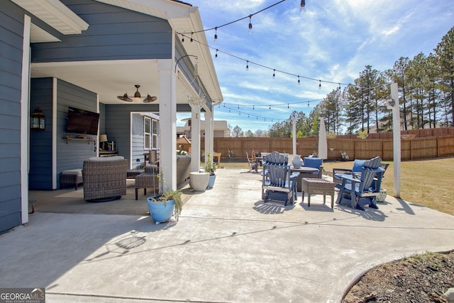 view of patio featuring fence and an outdoor living space