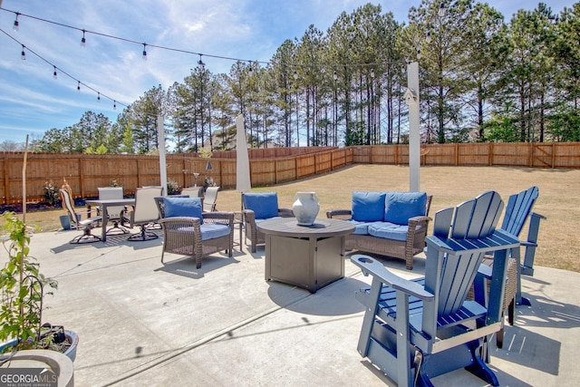 view of patio with an outdoor living space, a fenced backyard, and outdoor dining area