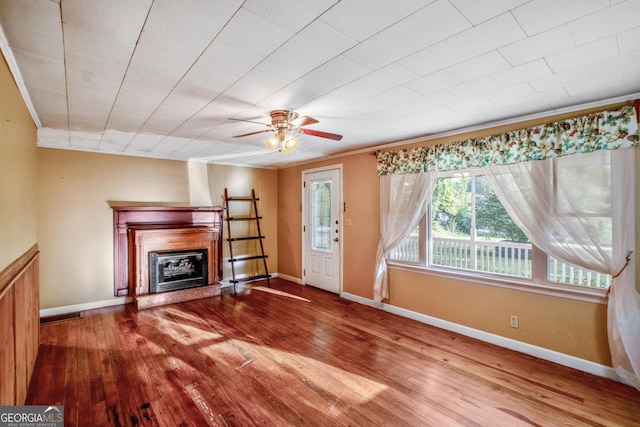 256 Black Rock Mountain Pkwy, Clayton, GA 30525 - unfurnished living room with baseboards, ceiling fan, a glass covered fireplace, and wood-type flooring