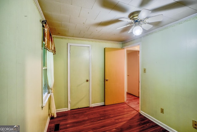 256 Black Rock Mountain Pkwy, Clayton, GA 30525 - unfurnished bedroom featuring visible vents, crown molding, baseboards, wood finished floors, and a ceiling fan