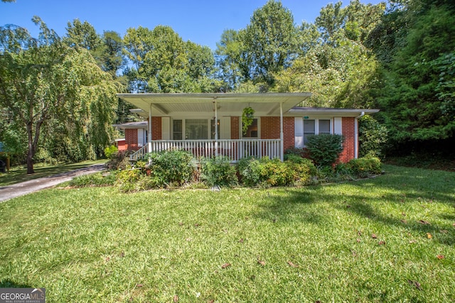 256 Black Rock Mountain Pkwy, Clayton, GA 30525 - ranch-style home featuring brick siding, a porch, and a front lawn