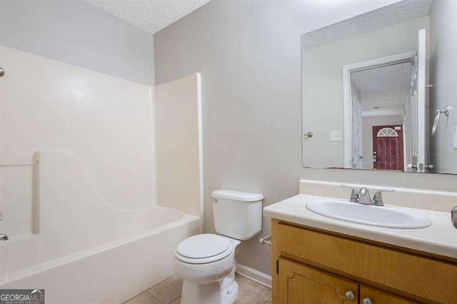 bathroom with tile patterned flooring, vanity, toilet, a textured ceiling, and washtub / shower combination