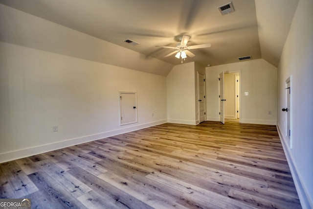 bonus room featuring lofted ceiling, a ceiling fan, and visible vents