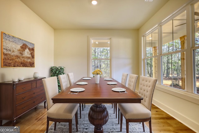 dining area featuring wood finished floors and baseboards