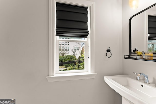 6635 Canyon Cv, Cumming, GA 30028 - bathroom featuring a wealth of natural light and a sink