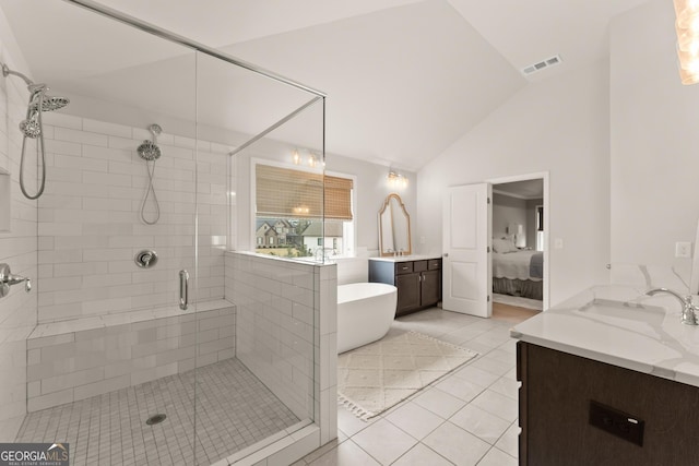 6635 Canyon Cv, Cumming, GA 30028 - ensuite bathroom with tile patterned floors, a sink, a stall shower, visible vents, and lofted ceiling