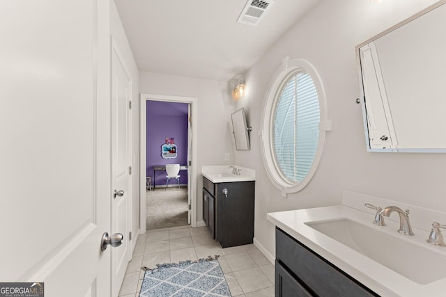 6635 Canyon Cv, Cumming, GA 30028 - bathroom featuring tile patterned floors, visible vents, a sink, baseboards, and two vanities