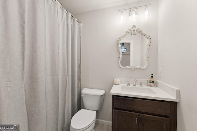 6635 Canyon Cv, Cumming, GA 30028 - full bath with baseboards, vanity, tile patterned flooring, and toilet