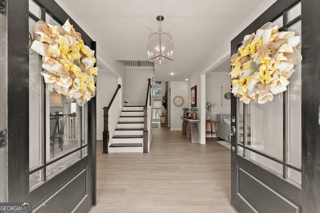 6635 Canyon Cv, Cumming, GA 30028 - entrance foyer featuring recessed lighting, baseboards, a chandelier, light wood-style flooring, and stairs