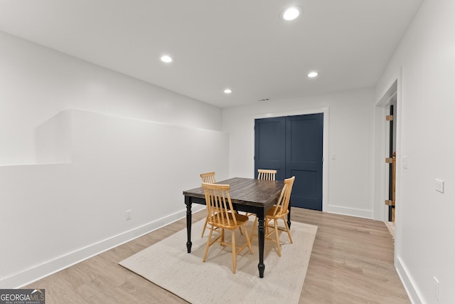 6635 Canyon Cv, Cumming, GA 30028 - dining space featuring baseboards, recessed lighting, and light wood-type flooring