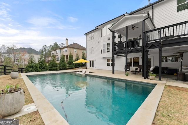 6635 Canyon Cv, Cumming, GA 30028 - outdoor pool featuring fence, a residential view, a patio, and ceiling fan