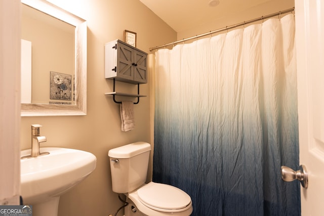 additional living space with baseboards, a textured ceiling, light wood-style flooring, and lofted ceiling
