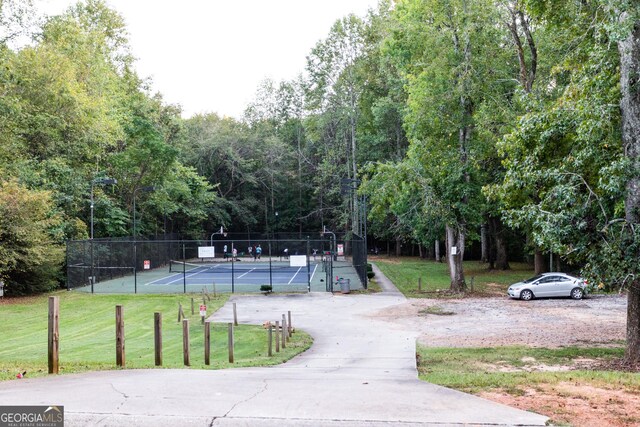 view of community featuring a gazebo, a water view, and a lawn
