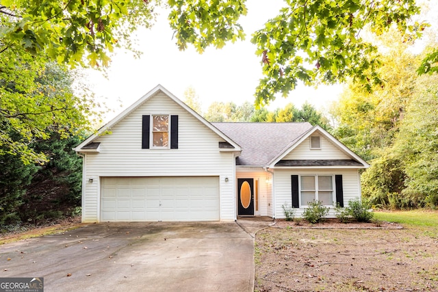 obstructed view of property with concrete driveway and a garage