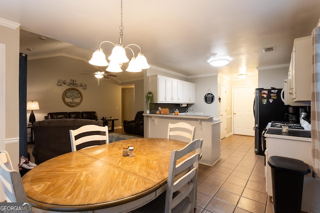 kitchen with a sink, white cabinets, white appliances, and light tile patterned flooring
