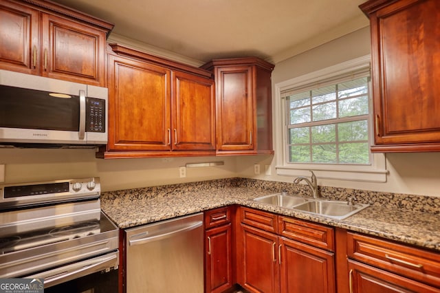kitchen with a sink and appliances with stainless steel finishes