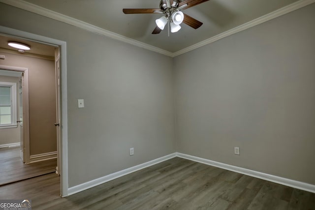 unfurnished room with baseboards, ornamental molding, wood finished floors, and a ceiling fan
