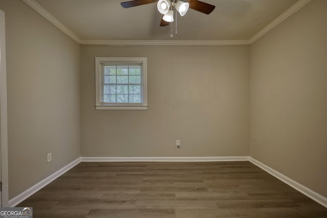 unfurnished room with baseboards, ceiling fan, wood finished floors, and ornamental molding