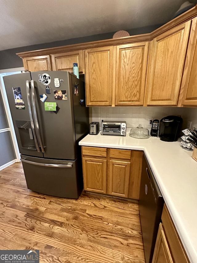 4100 Jewel Rdg, Monroe, GA 30655 - kitchen featuring stainless steel fridge, light wood finished floors, dishwashing machine, and light countertops