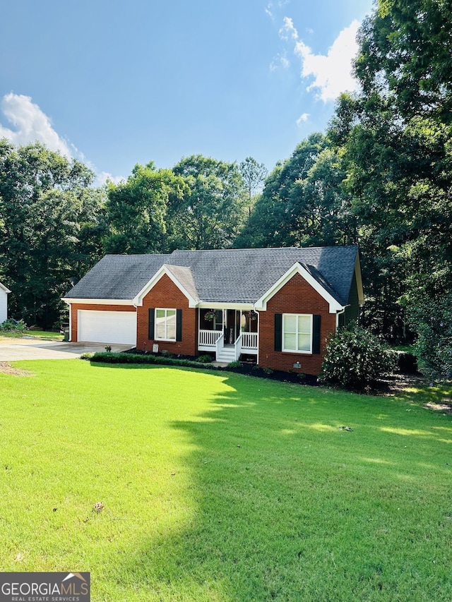 4100 Jewel Rdg, Monroe, GA 30655 - single story home featuring a porch, a front lawn, driveway, brick siding, and roof with shingles