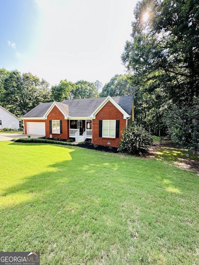 4100 Jewel Rdg, Monroe, GA 30655 - ranch-style home with brick siding, a front yard, covered porch, and a garage