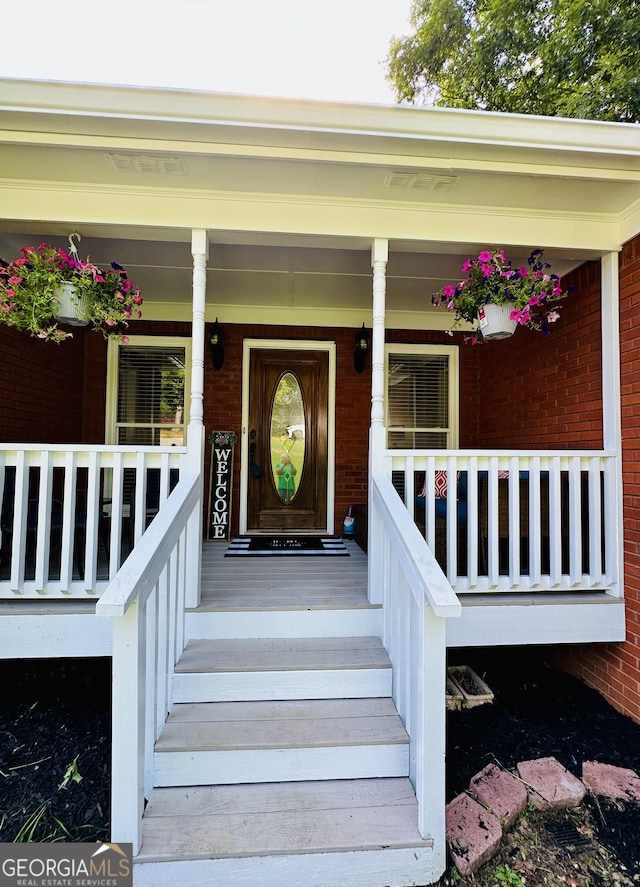4100 Jewel Rdg, Monroe, GA 30655 - view of exterior entry featuring covered porch and brick siding